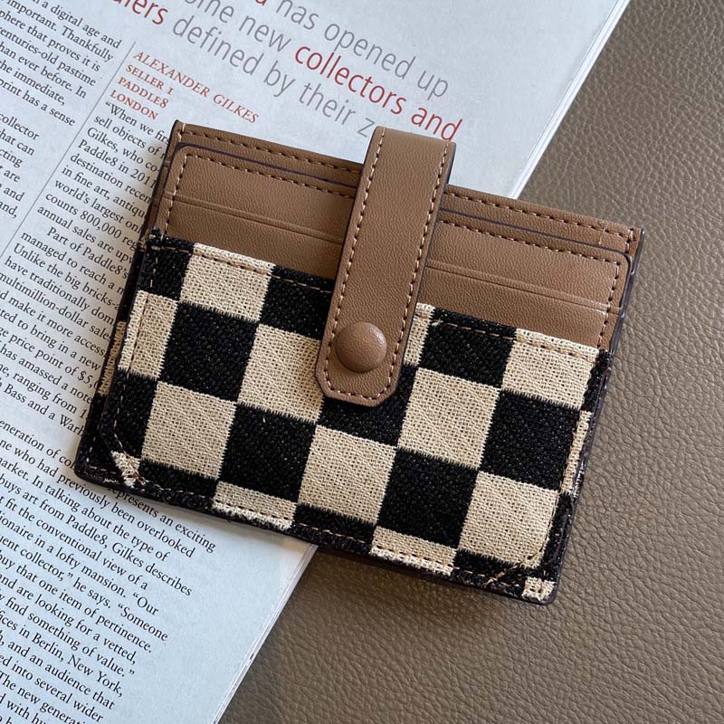 Interior detail of women's compact wallet, showcasing card holder slots and space