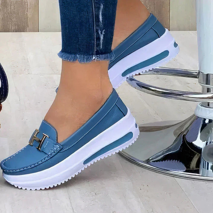New women's platform loafers. Sleek modern design, comfortable slip-on style, versatile for office or casual outfits.