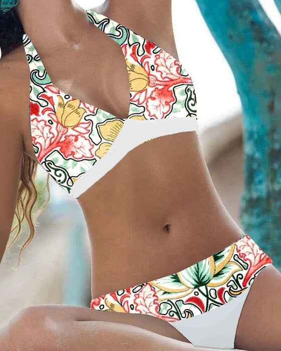 Women's playful floral & polka dot bikini swimsuit. Ideal for summer vacations & beachwear.