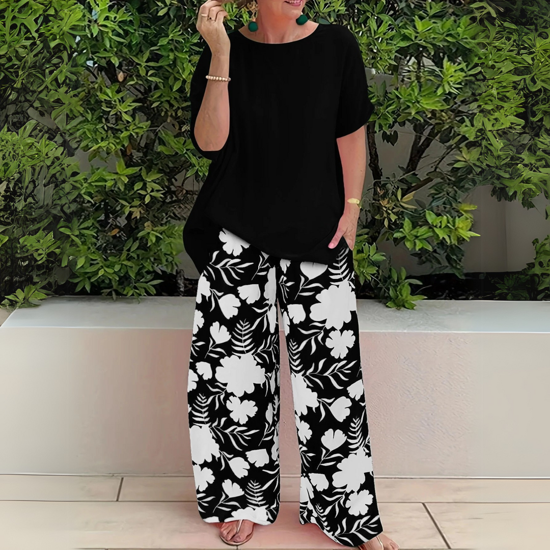 Comfortable plus size women's floral print two-piece loungewear set with elegant wide-leg pants for summer.
