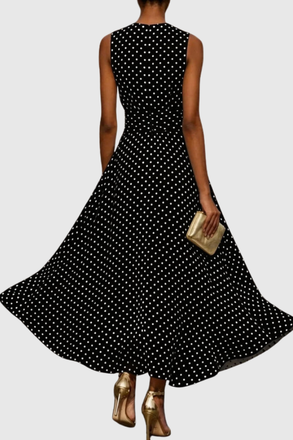 Flowy polka dot maxi dress for women, A-line silhouette with a romantic ruffle hem, perfect for elegant summer events.