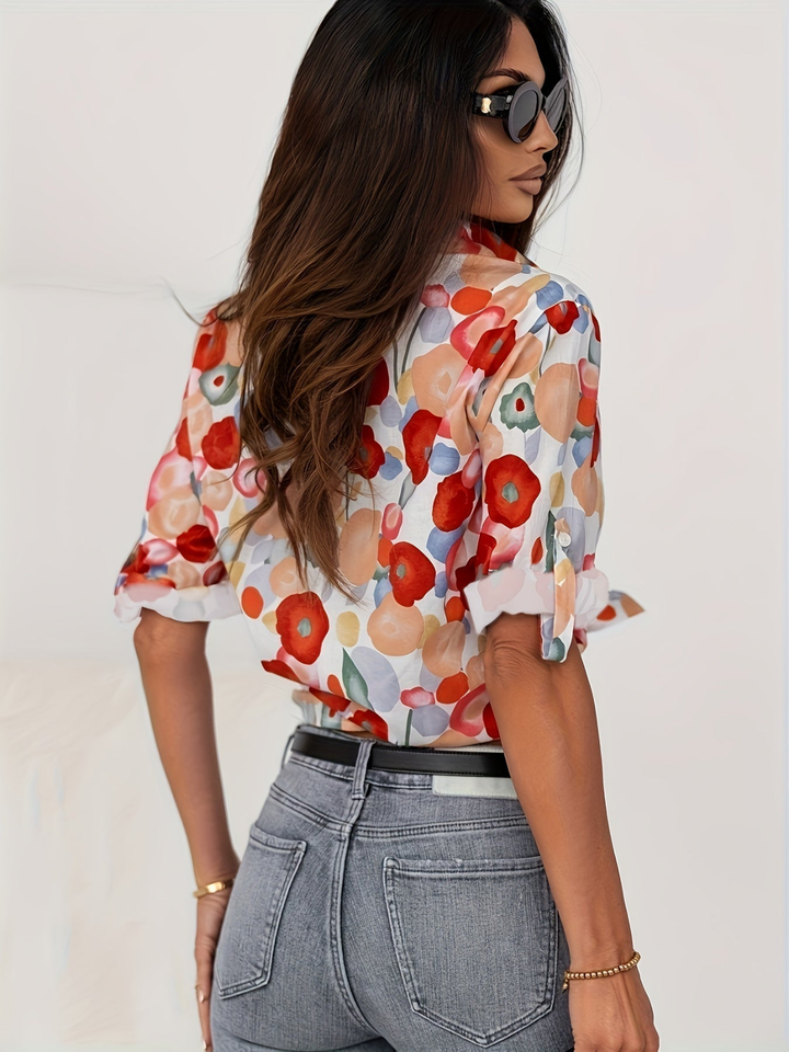 Elegant women's poppy bold floral long-sleeve button-down shirt. Collared, versatile top for casual fashion.