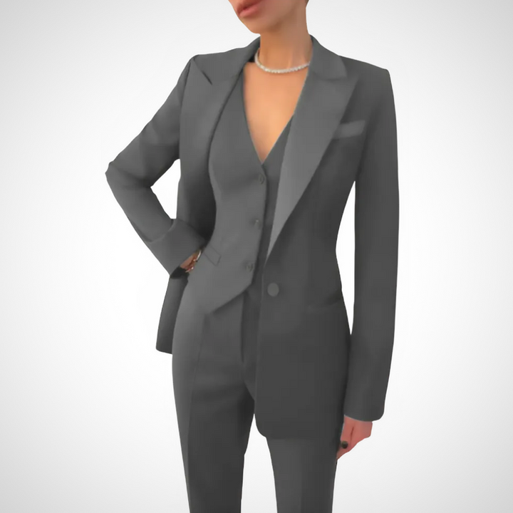 Chic women's 3-piece suit: a well-tailored blazer, vest, and trousers. Ideal for professional office attire.