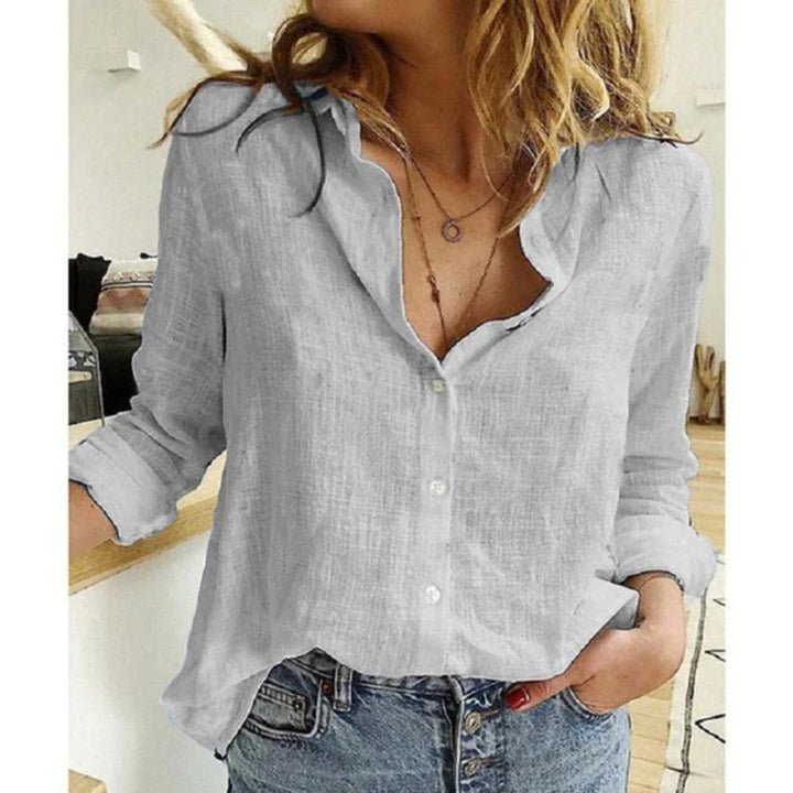 Chic women's long sleeve blouse with elegant bird print and classic button-down style.