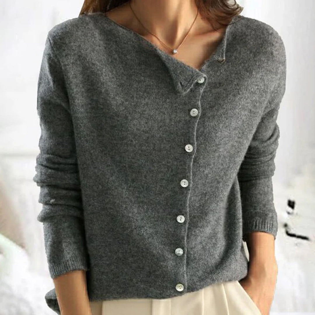 Fashionable women's relaxed fit button-front cardigan, a warm knitwear piece for cold weather.