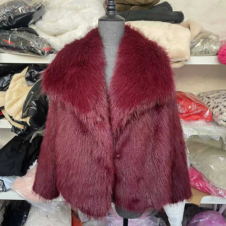 Women's outerwear: A relaxed fit faux fur jacket casually draped, emphasizing its cozy and elegant appeal