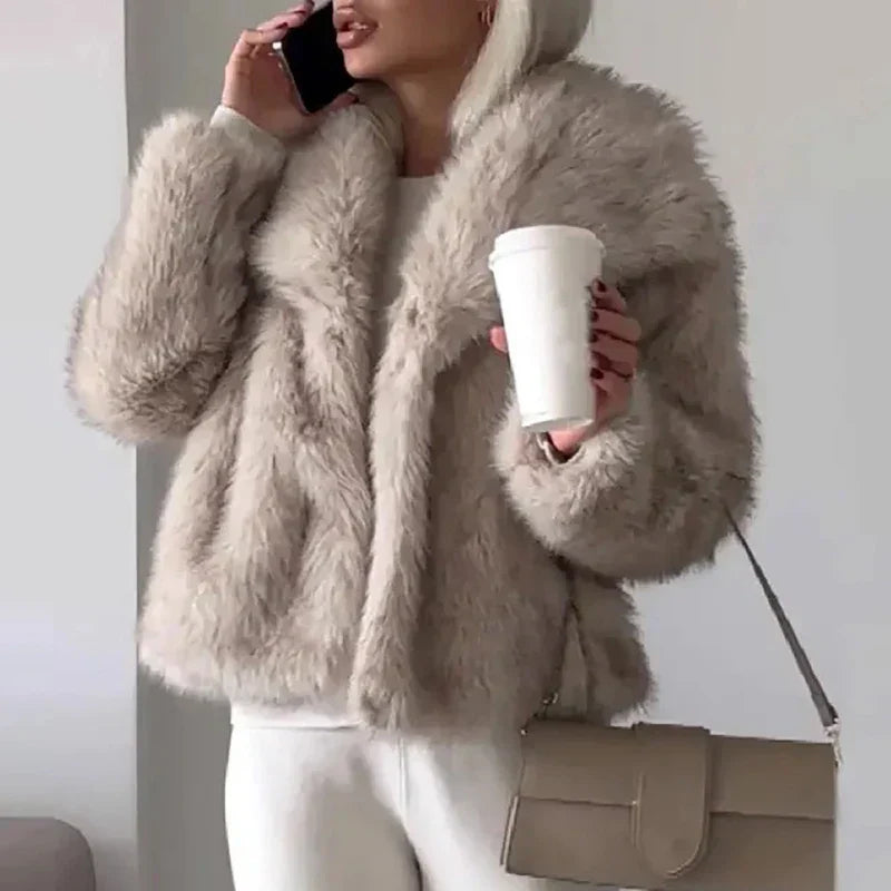 Cozy women's relax fit faux fur jacket with a soft texture, ideal outerwear for cold weather