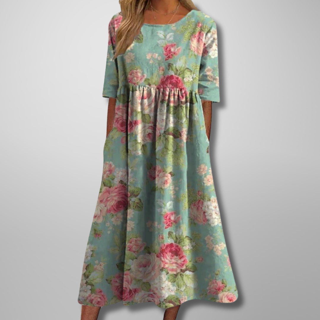 Elegant women's flowy floral midi dress with a relaxed fit, ideal for versatile summer fashion.