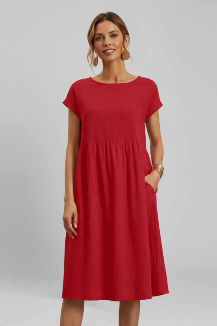 Women's casual knee-length dress, relaxed fit, ideal for summer, with a round neck, short sleeves, and pockets.