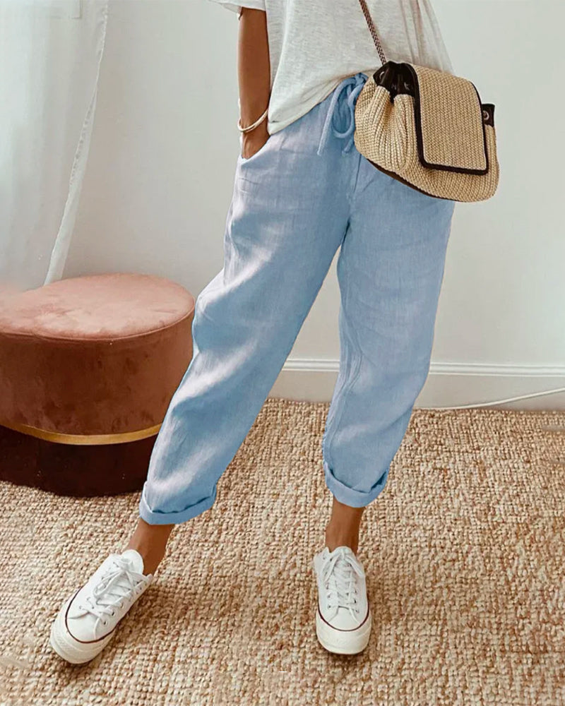 Comfortable women's relaxed linen joggers with a practical drawstring waist, great for casual summer outfits.
