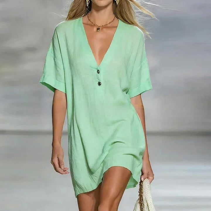 Comfortable women's V-neck shirt dress. Relaxed fit button-front style, ideal for warm weather fashion.