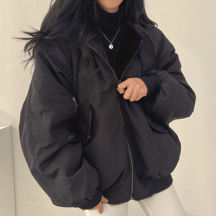 Women's outerwear jacket, dark grey, relaxed fit, designed for warmth and casual winter style.