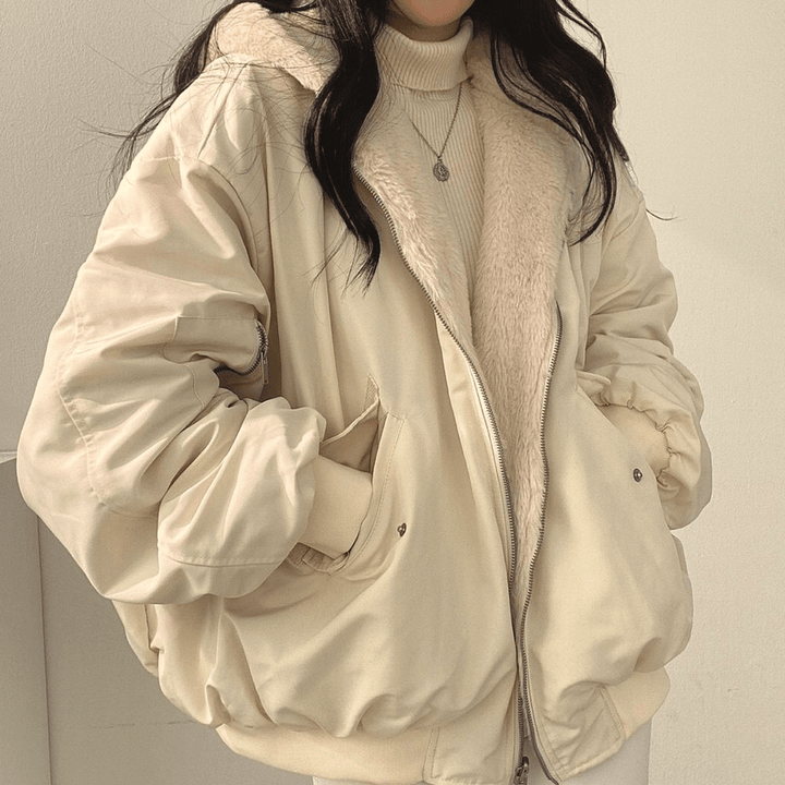 Inside view of a women's relaxed fit warm winter jacket, showing fuzzy lining and quality stitching.