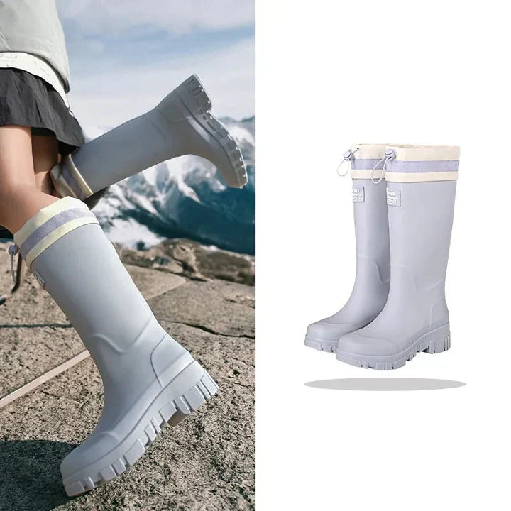 Close-up of anti-slip sole on women's retro waterproof rain boots, ensuring traction on wet autumn surfaces.