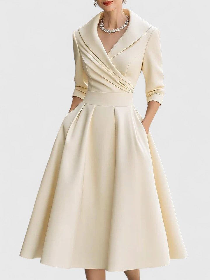 Flattering women's A-line midi dress with ruched bodice & wrap collar. Ideal for elegant wedding guest attire.