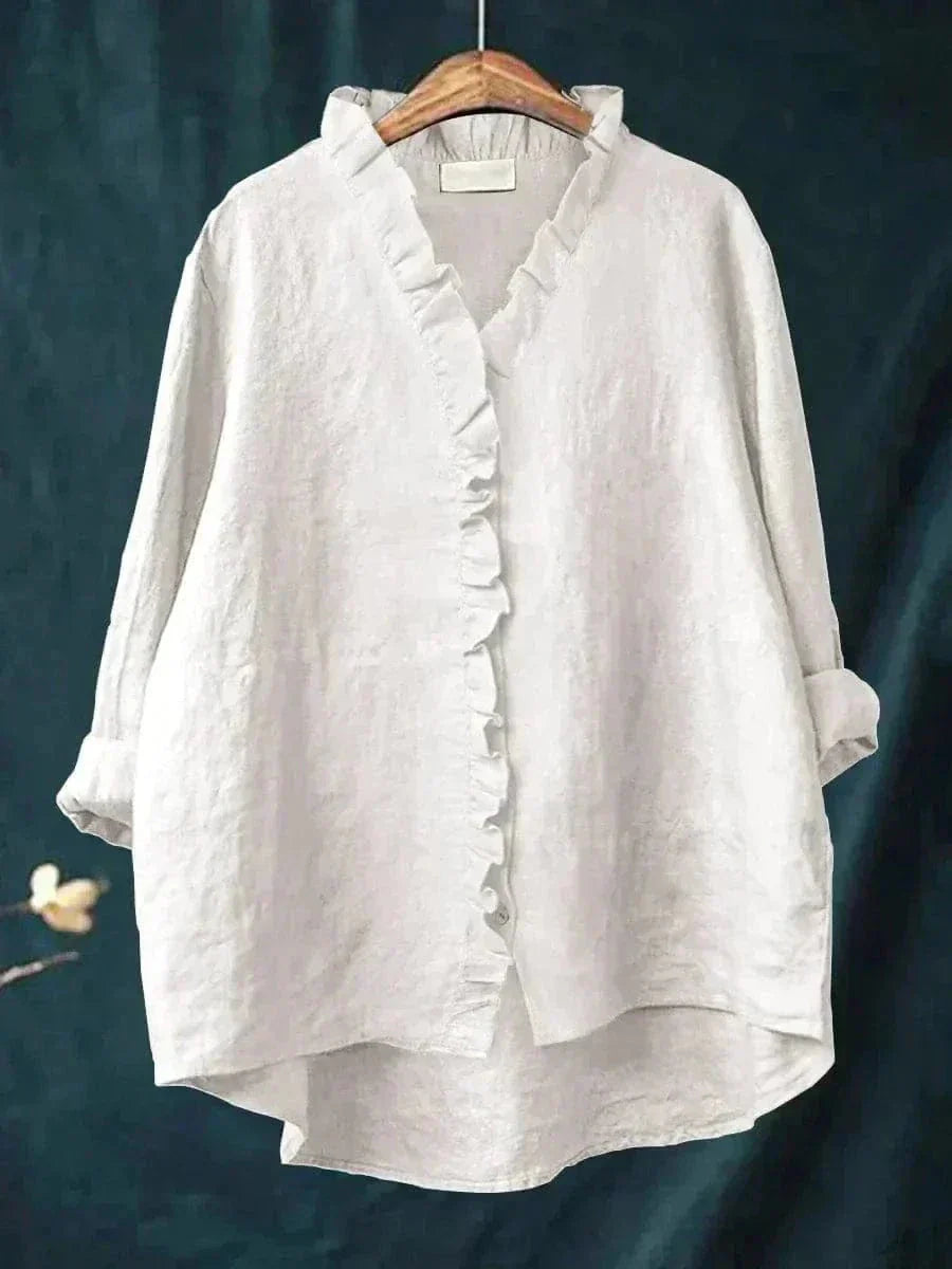 Elegant women's apparel: a lightweight ruffle neck summer blouse with a comfortable relaxed fit.