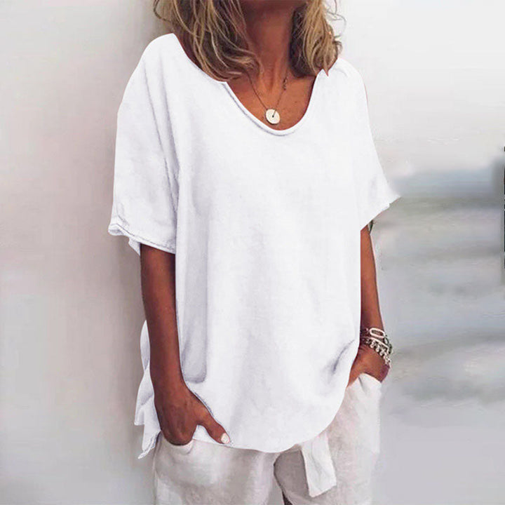 Comfortable women's short sleeve scoop neck blouse with a loose fit, ideal for casual and versatile wear.
