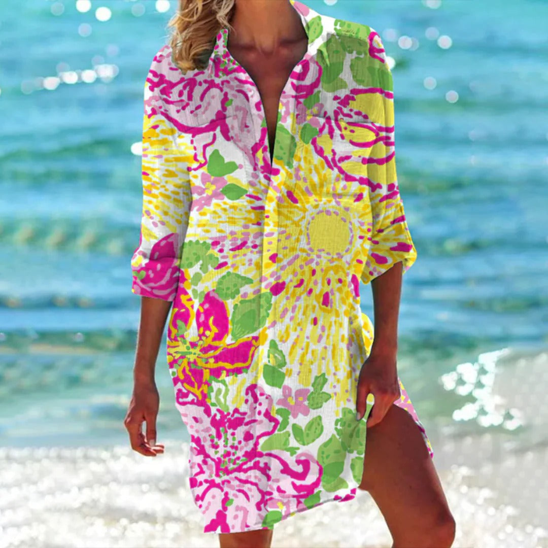 Stylish women's beach cover-up shirt dress. Seashell print, 3/4 sleeves. Ideal for vacation and resort outfits.