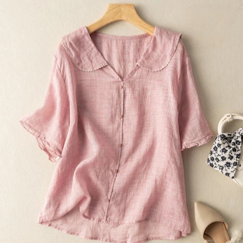 Chic women's button-up blouse with a distinctive scalloped collar and short sleeves. Ideal for everyday elegance.