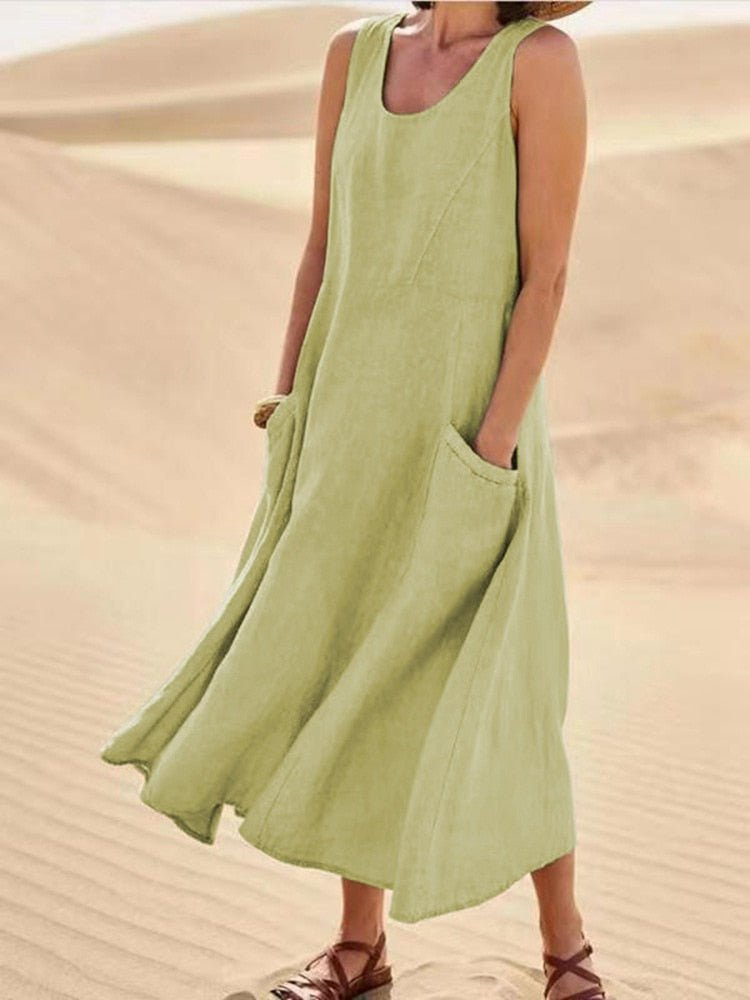 Versatile women's casual sleeveless pocket midi dress with scoop neck, perfect for summer & warm weather.