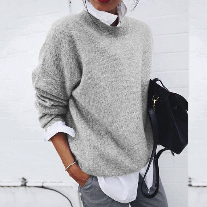Soft knit women's pullover sweater with a classic round neck, suitable for winter fashion.