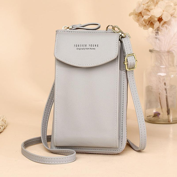 Front flap detail of the women's PU leather crossbody wallet, with a subtle logo