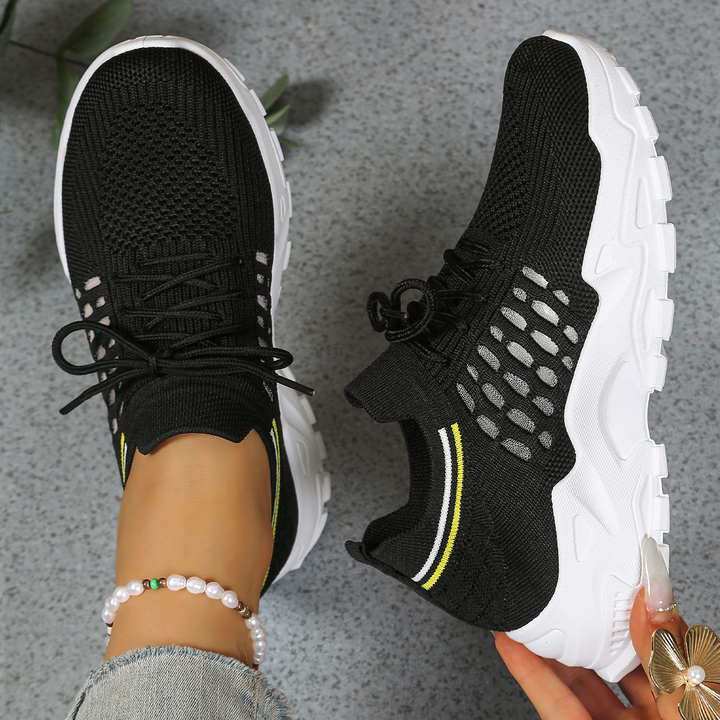 Breathable women's orthopedic sneakers with lace-up support for active and comfortable everyday wear.