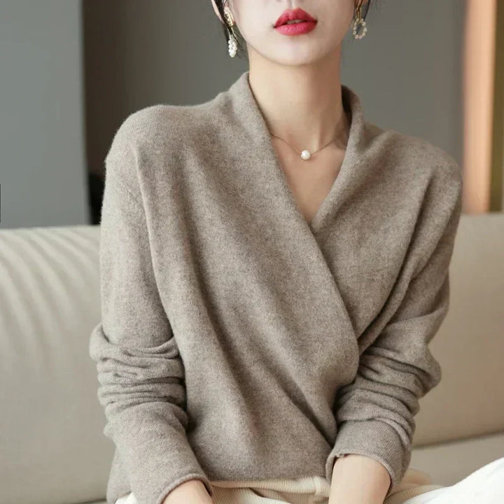 Pairing a women's knit wrap neck top with jeans, demonstrating a chic casual spring outfit.