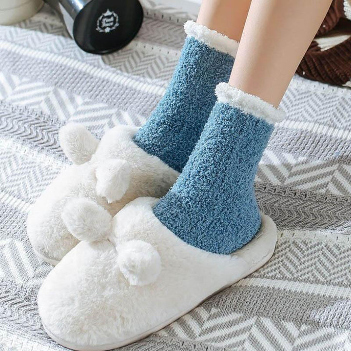 Various colors of women's fleece-lined thermal socks displayed, essential winter footwear.