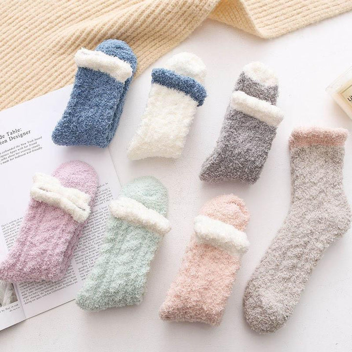A pair of women's thermal winter socks, fleece-lined and ready for chilly days.