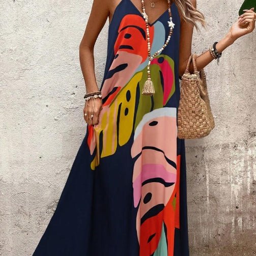 Flowy sleeveless maxi dress for women, featuring a tropical print, ideal for summer beach and resort wear.