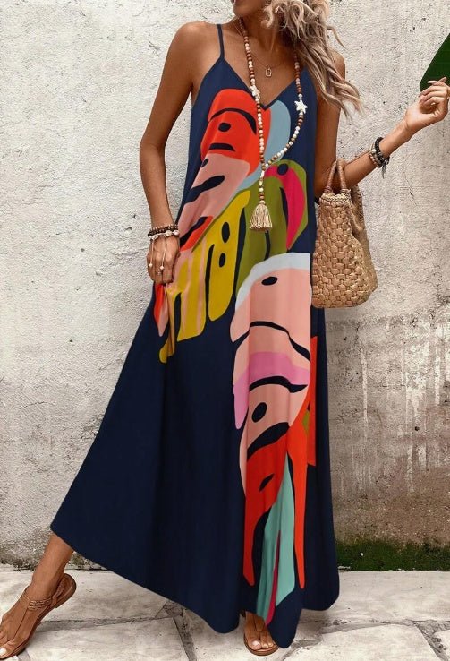 Casual chic women's tropical maxi dress with a stylish leaf print, designed for breezy summer comfort.