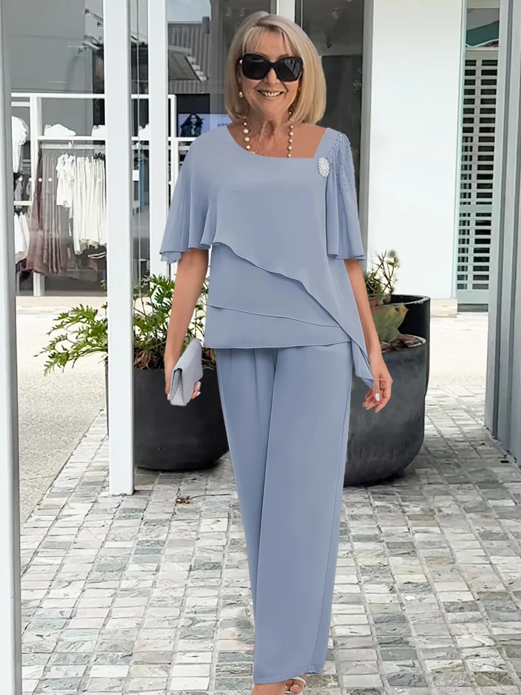 Women's two-piece short sleeve top and straight leg pants set. Comfortable & chic coordinated casual summer outfit.