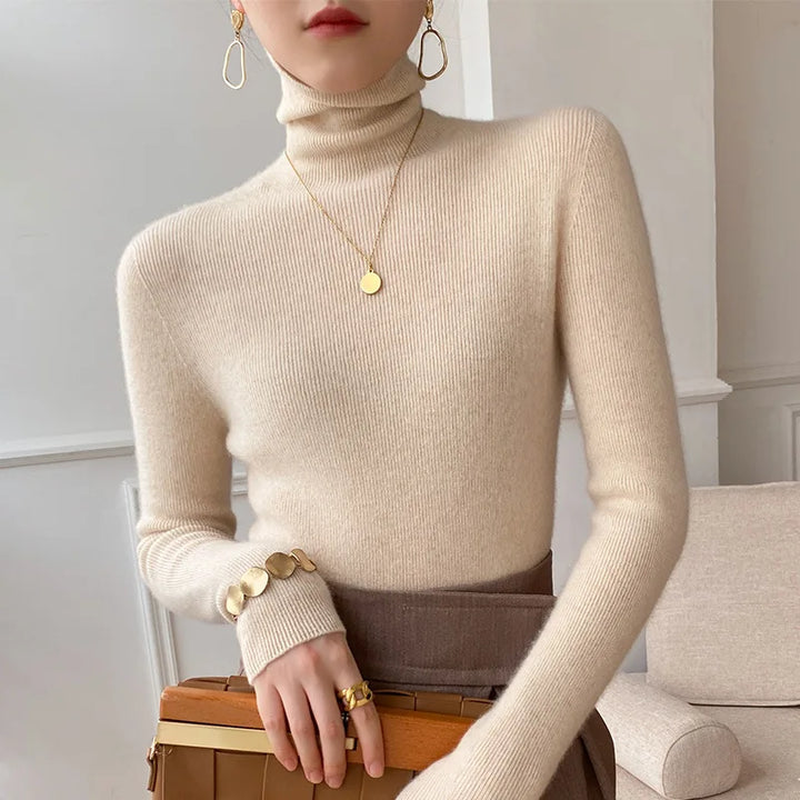 Women's ultra-soft cashmere turtleneck sweater, a luxurious and warm layering piece.