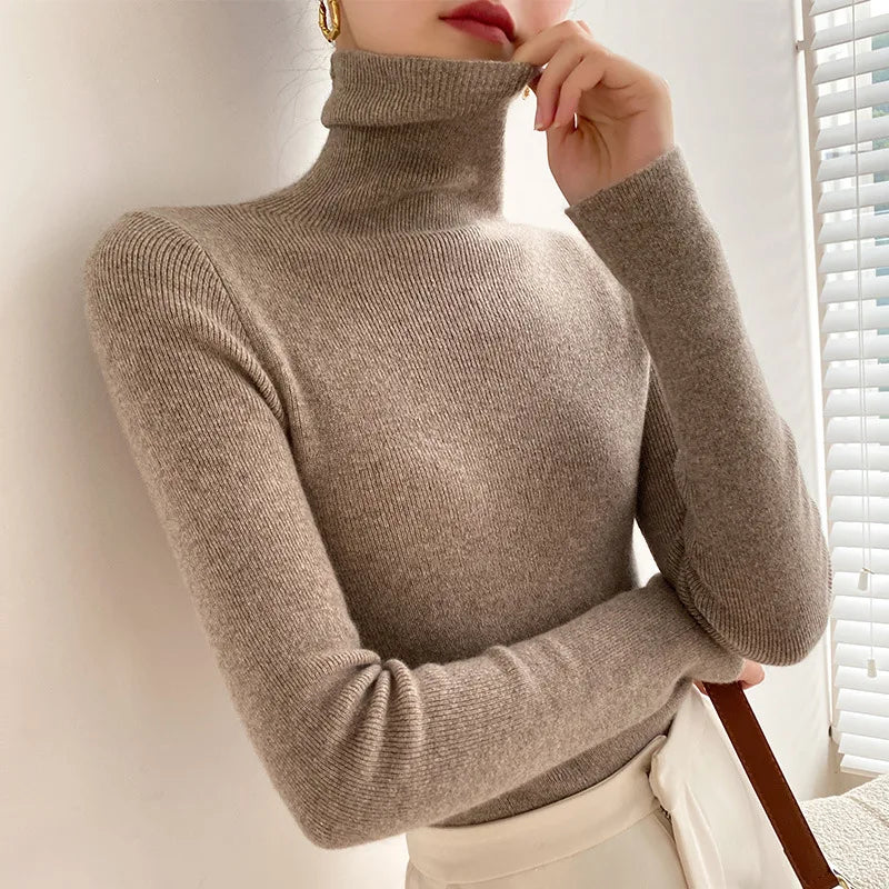 Cozy women's cashmere turtleneck for ultimate warmth. Soft luxury knit, great for cold-weather layering.