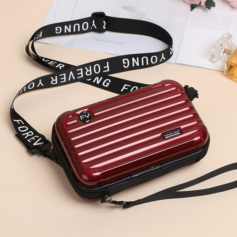 Contemporary women's mini suitcase crossbody bag, a must-have fashion accessory
