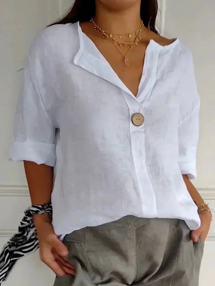 Versatile women's V-neck blouse with roll tab sleeves, ideal for office wear, casual spring or summer style.