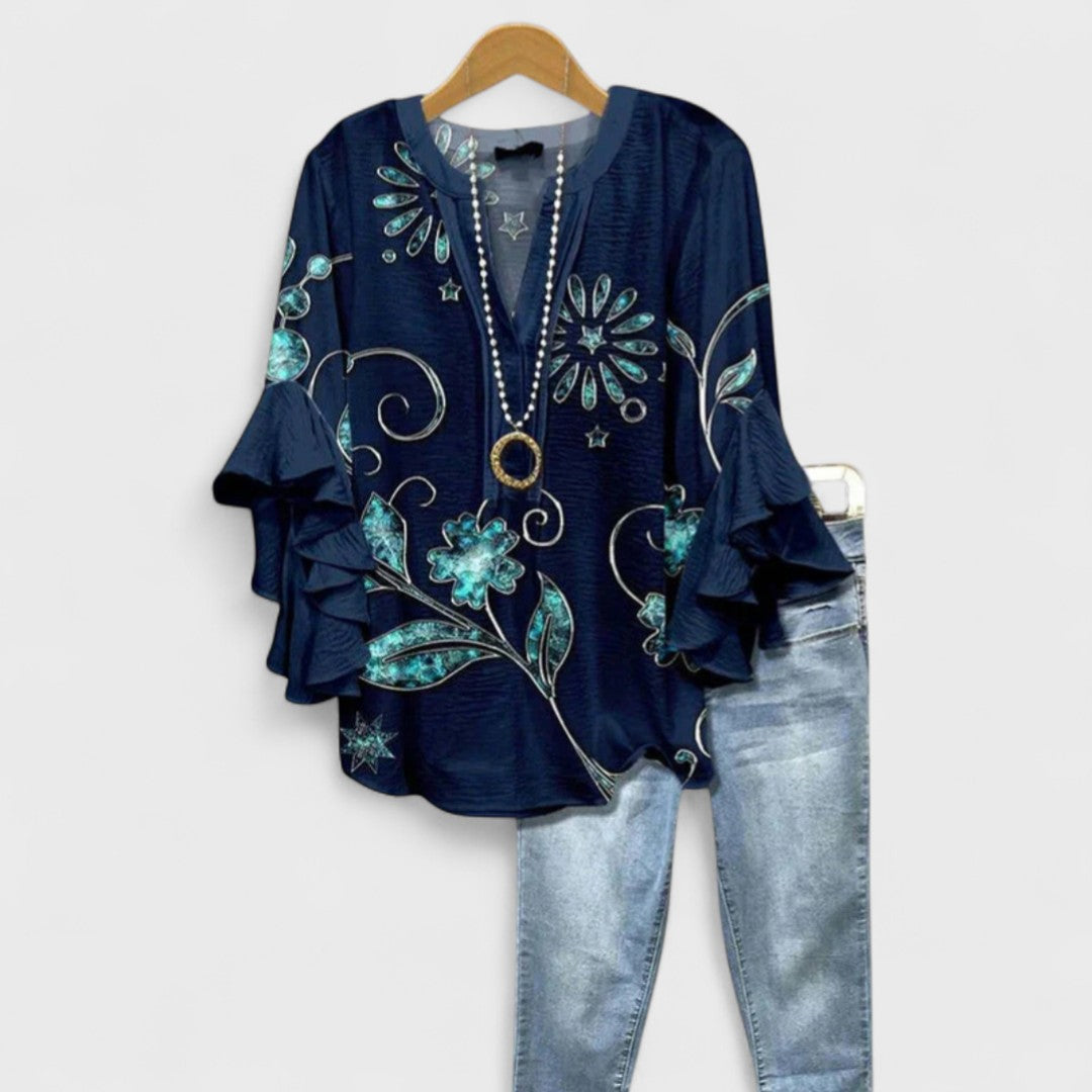 Stylish patterned V-neck blouse for women, featuring elegant ruffle sleeves & loose fit.