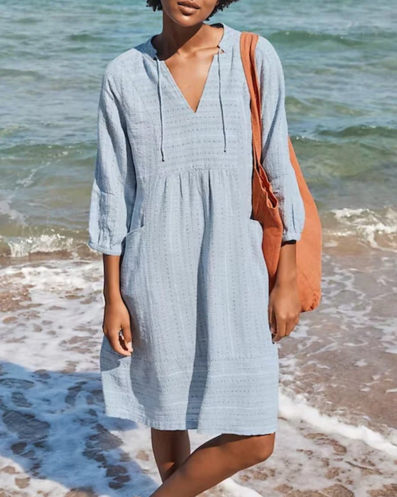 Flowy V-neck Bohemian midi dress for women, relaxed fit summer wear, ideal for beach or casual outings.