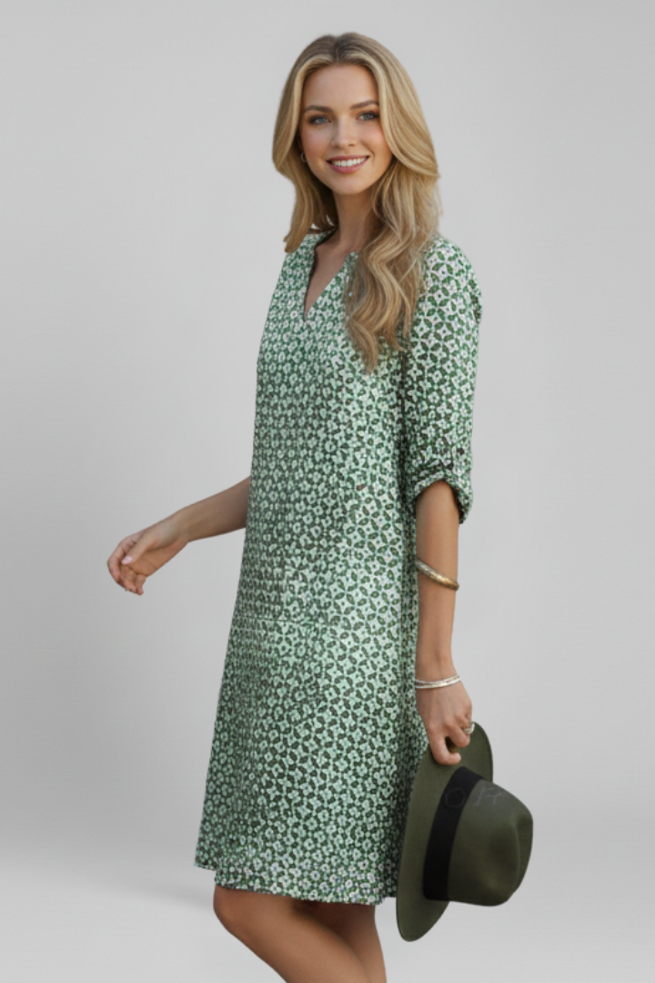 Chic spot pattern women's dress, V-neck, short sleeve, flared, ideal for casual wear.