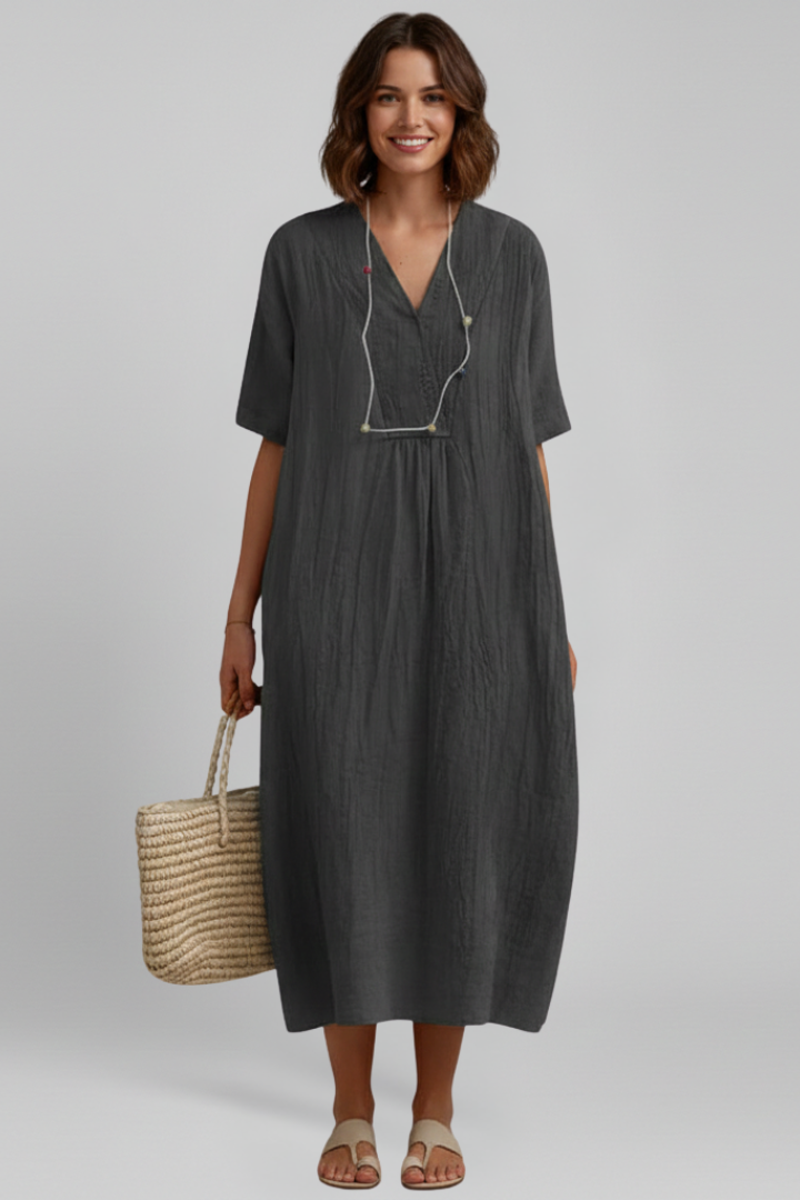 Versatile women's V-neck short sleeve dress with a spot pattern and flared silhouette.