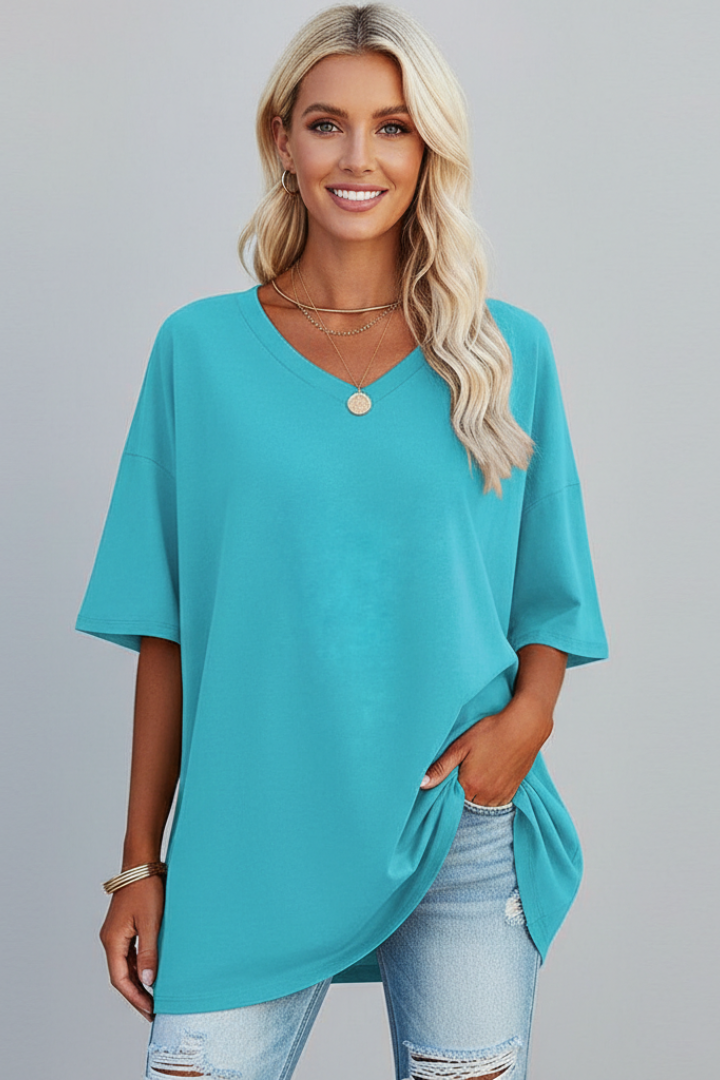 Stylish women's V-neck t-shirt, loose fit & short sleeves for comfortable, relaxed summer fashion.