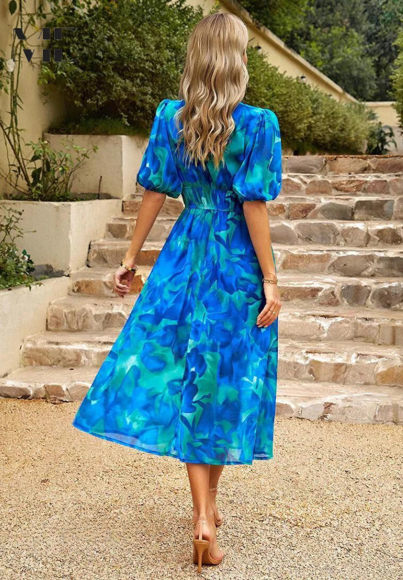 Comfortable women's V-neck midi dress, vibrant floral print, with a tie waist.