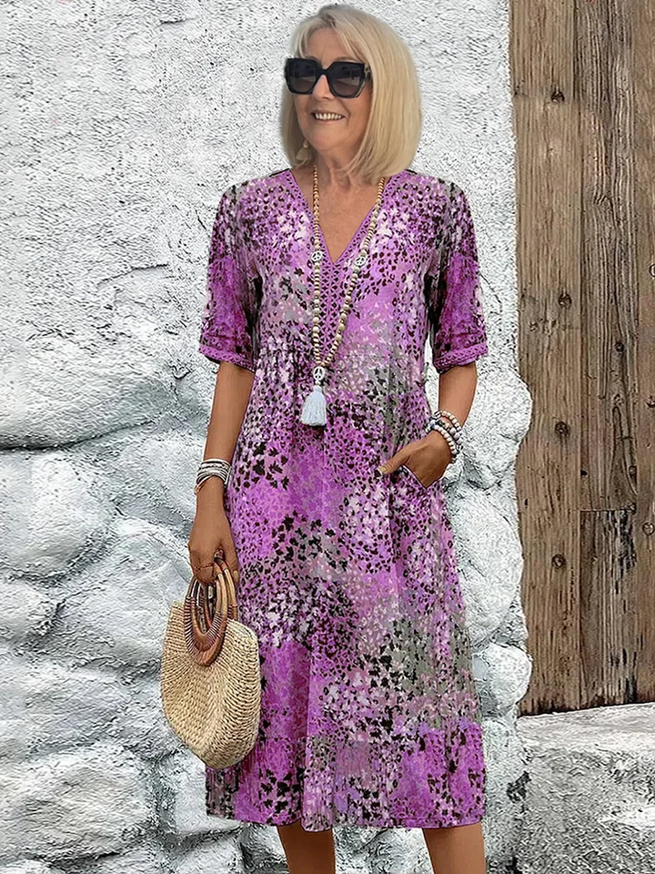 Stylish women's vibrant print flowy midi dress with a relaxed fit. Comfortable & elegant for spring/summer fashion.