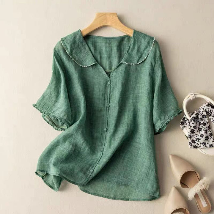 Women's vintage button blouse with scalloped collar. Elegant & versatile for casual or office wear.