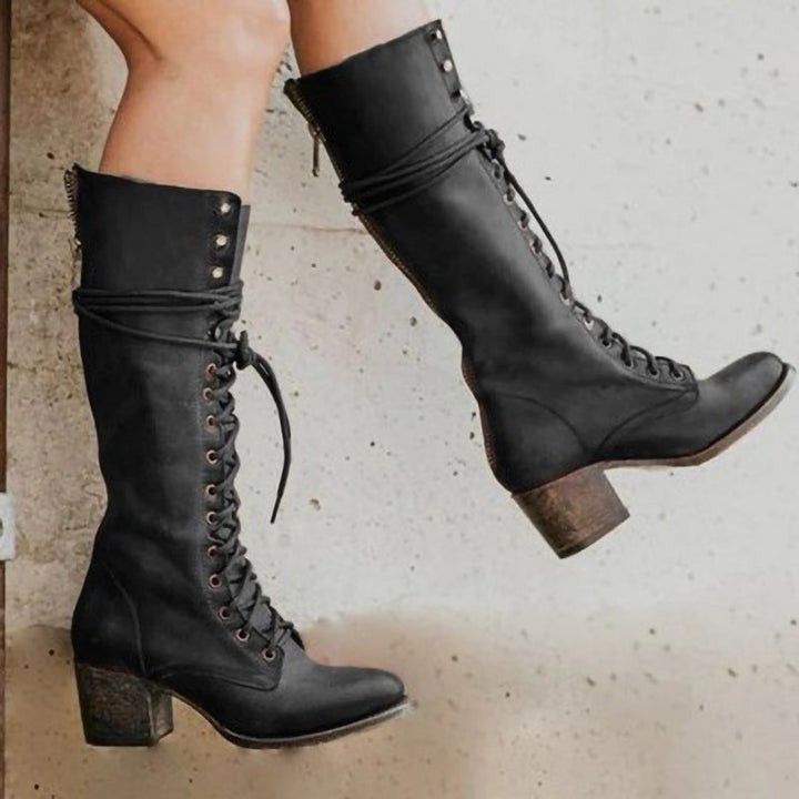 Elegant women's retro-style block heel boots, featuring delicate lace-ups and a fashionable vintage design.
