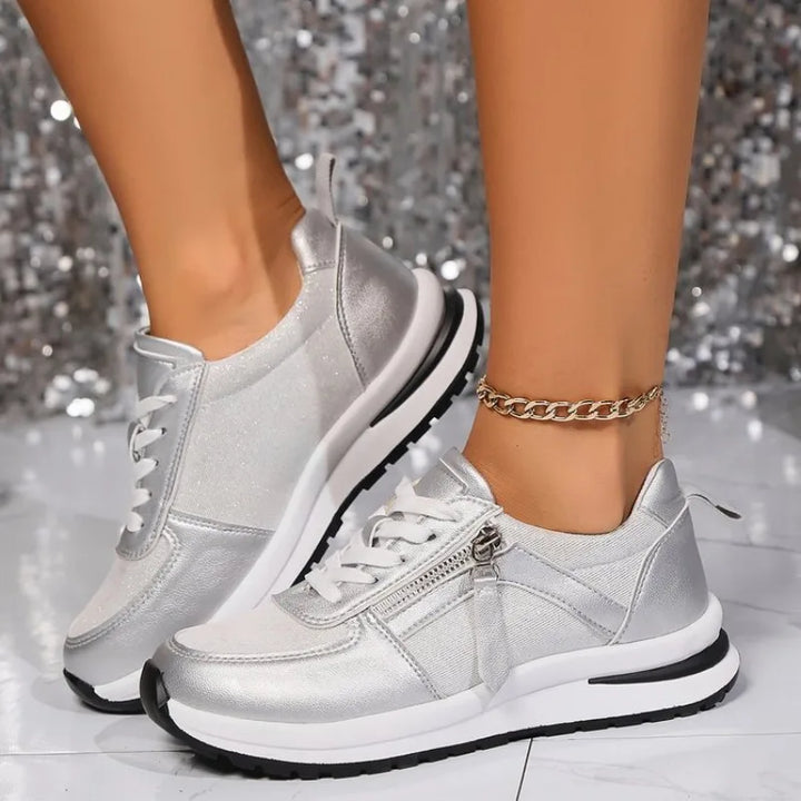 Side view of women's comfortable everyday sneakers, featuring a vintage look and practical side zip.