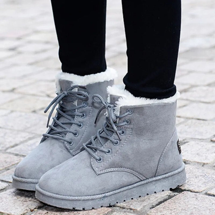 Stylish women's insulated ankle boots with lace-up front, perfect for winter and casual wear.