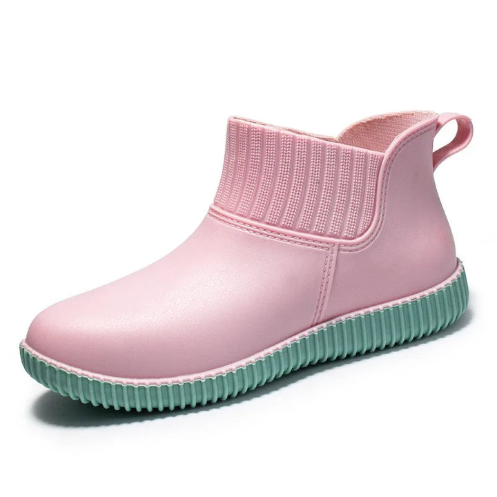Cozy women's waterproof ankle boots for rain, featuring a knitted comfort cuff and reliable non-slip sole.
