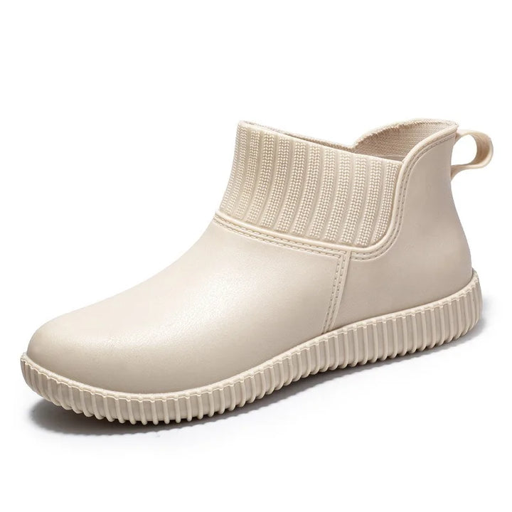 Casual women's waterproof ankle boots, featuring a knitted top and non-slip design, great for rainy days.